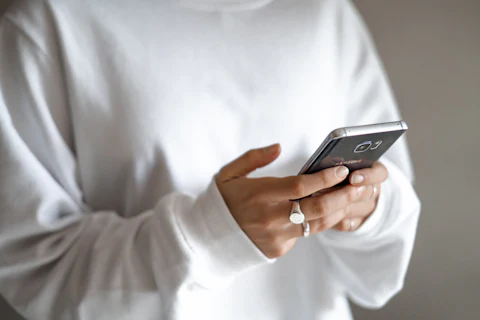 Two hands holding a smartphone