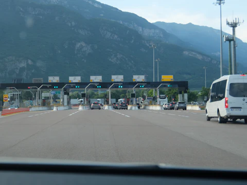 Cars approaching a motorway toll plaza